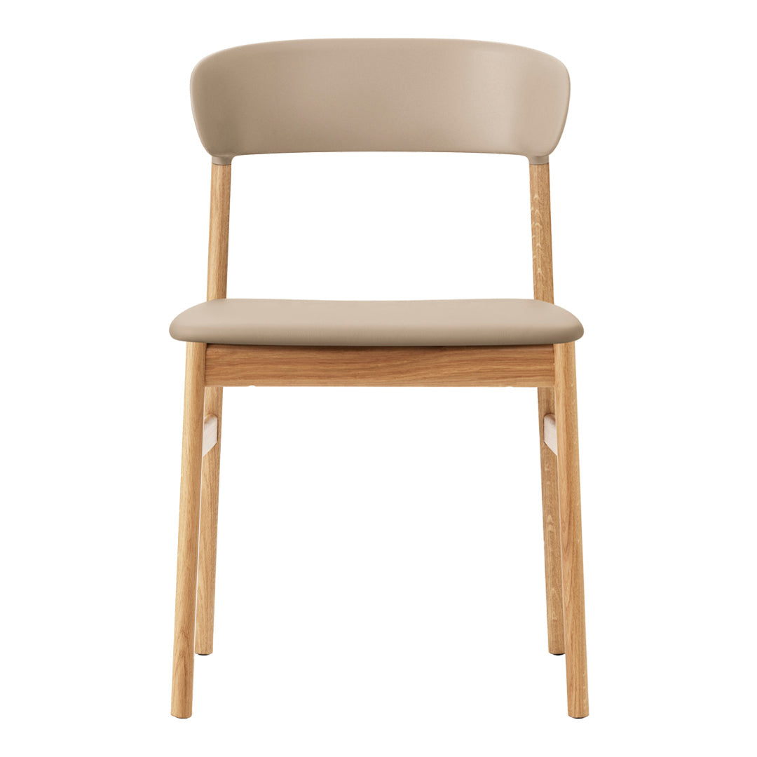 Neutral beige chair with a smooth padded seat and a light wood frame, showcasing minimalist design and soft tones.