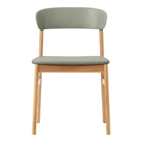 "Solid oak chair with a soft green seat and backrest, featuring a minimalist design with smooth lines."
