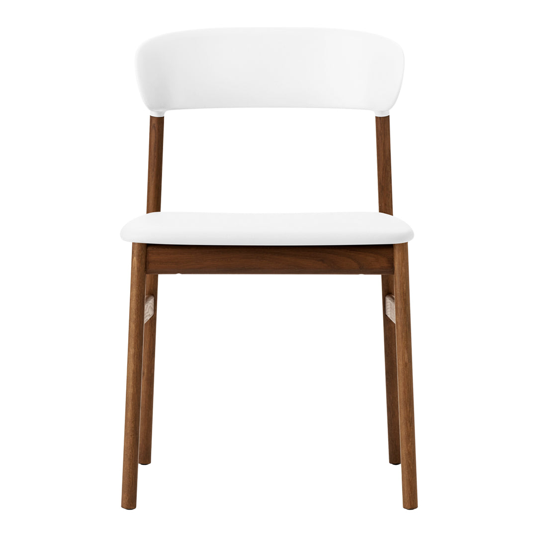 White upholstered chair with a smooth, minimalist design and sturdy walnut wood legs.