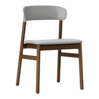 Modern chair featuring a soft grey seat and backrest with natural wood legs for a sleek, minimalist look.