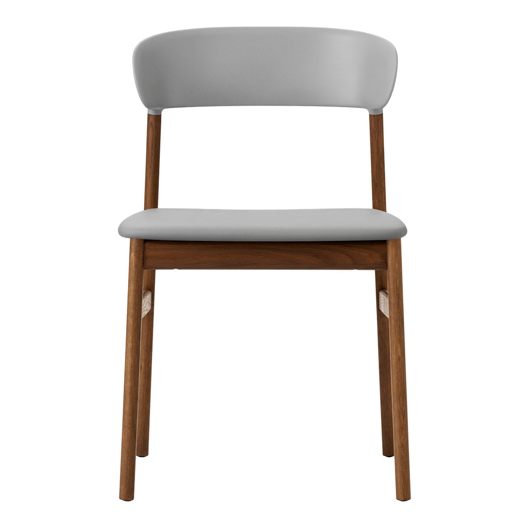 Gray upholstered chair with a smooth finish and natural wood legs, featuring a minimalist design.