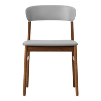 Gray upholstered chair with a smooth finish and natural wood legs, featuring a minimalist design.