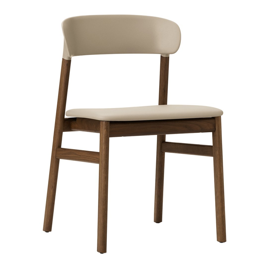 Beige upholstered chair with a sleek, natural wood frame. Simple, modern design enhances any space.