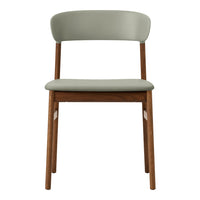 "Minimalist chair with a soft green seat and backrest, paired with natural wood legs."