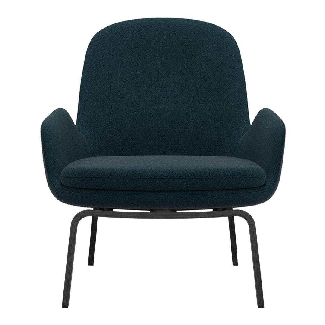 Teal upholstered armchair with a smooth, minimalistic design and sleek black metal legs.