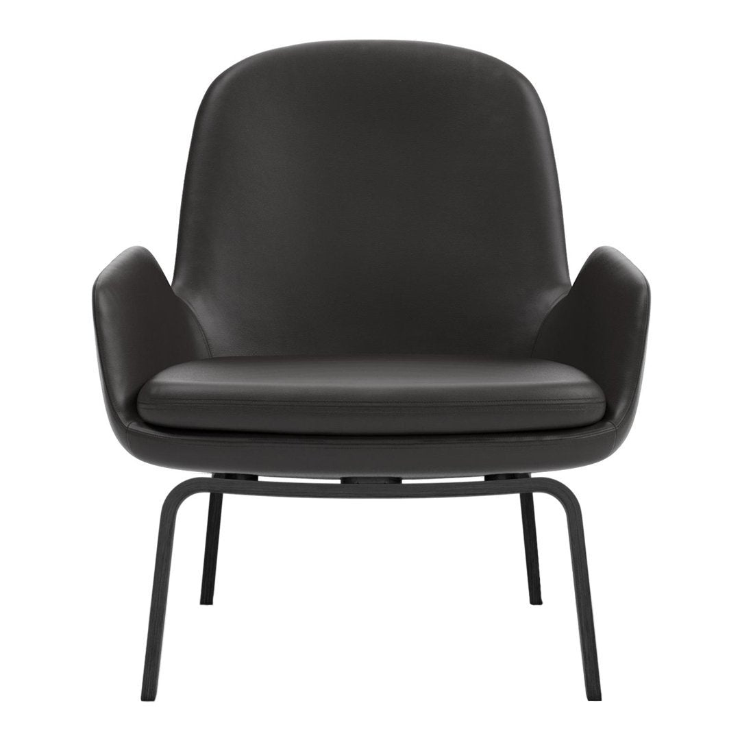 Sleek black leather armchair with smooth, minimalist design and subtle curved shape, secured on a matte black frame.