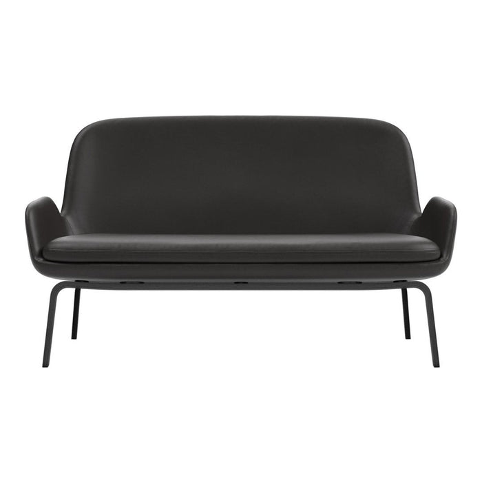 Black leather sofa with a smooth, minimalist design and sleek metal legs. Perfect for modern decor.