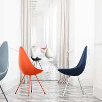 Colorful modern chairs in blue, orange, gray, white, and pink, with sleek lines and minimalist design patterns.