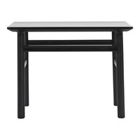 Black wooden table with a smooth rectangular top and straight legs. Sleek and minimalistic design.