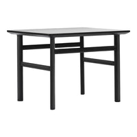 Black square table with a minimalistic design and straight legs, featuring a smooth matte surface and clean lines.