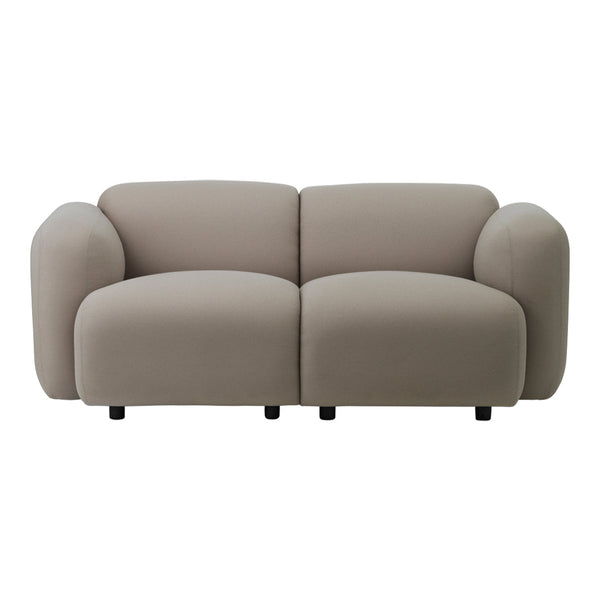 Stylish beige sofa with soft, rounded shapes and a smooth fabric texture, perfect for modern interiors.