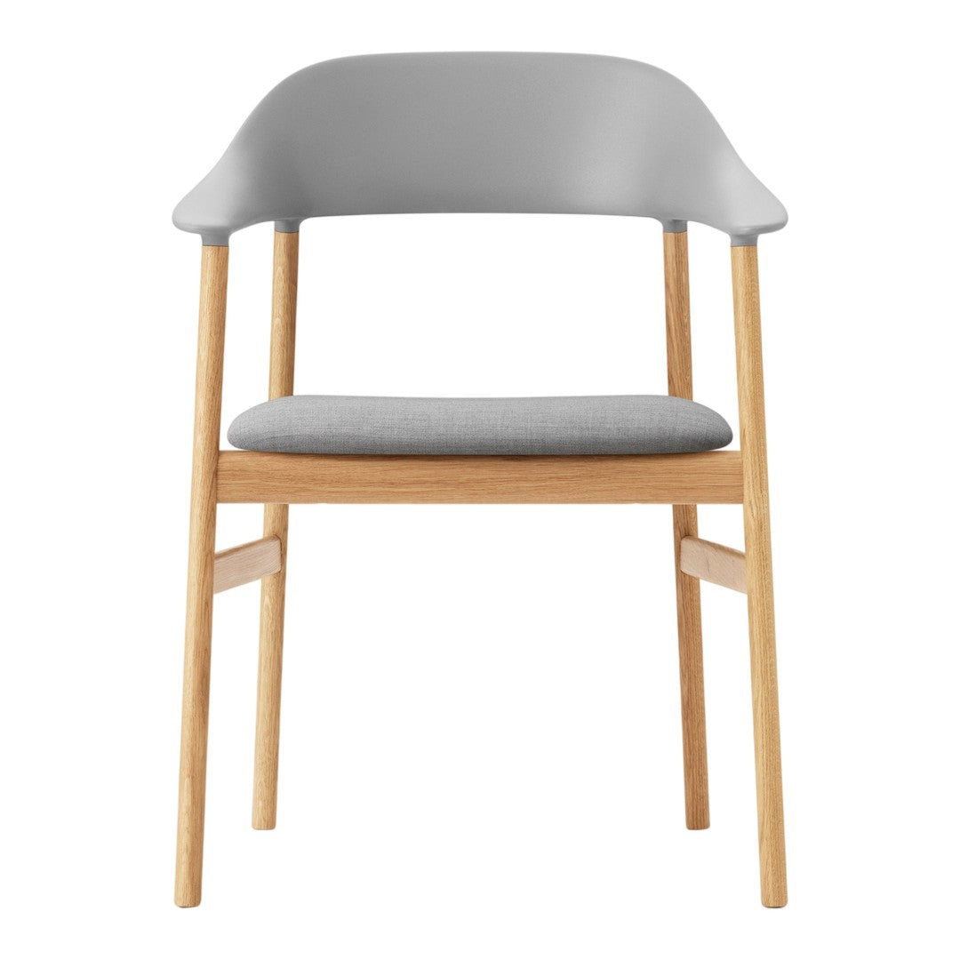 Gray upholstered chair with light wood legs and a minimalist design. Soft textures complement contemporary decor.