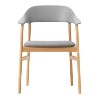 Gray upholstered chair with light wood legs and a minimalist design. Soft textures complement contemporary decor.