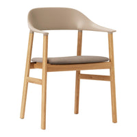 Beige molded plastic chair with light oak legs and a soft, taupe seat cushion, offering a minimalist design.