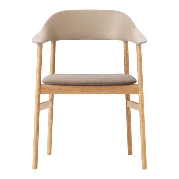 Beige plastic chair with light wood legs and a textured fabric seat cushion, perfect for modern interiors.