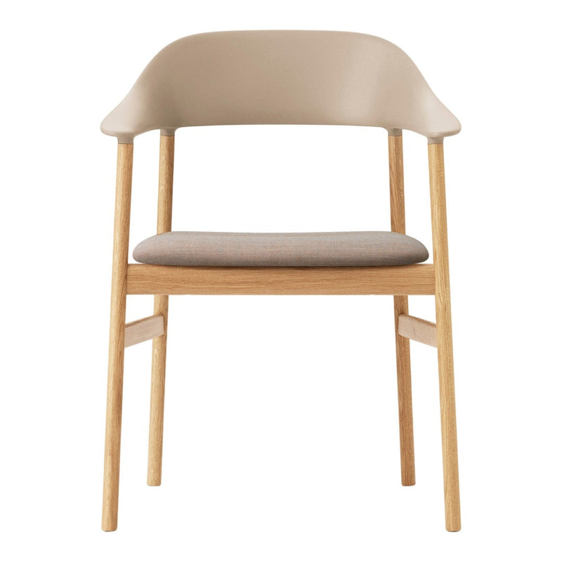 Beige plastic chair with light wood legs and a textured fabric seat cushion, perfect for modern interiors.