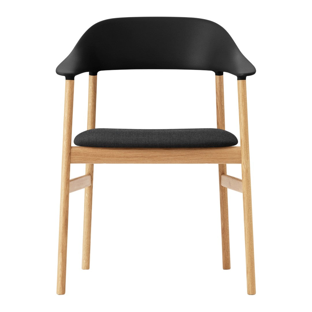 Black and wooden chair with a sleek design and gray upholstered seat, showcasing minimalistic elegance.