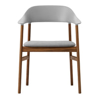 Modern chair with a light gray seat and backrest, complemented by a warm wood frame. Sleek and minimalist design.
