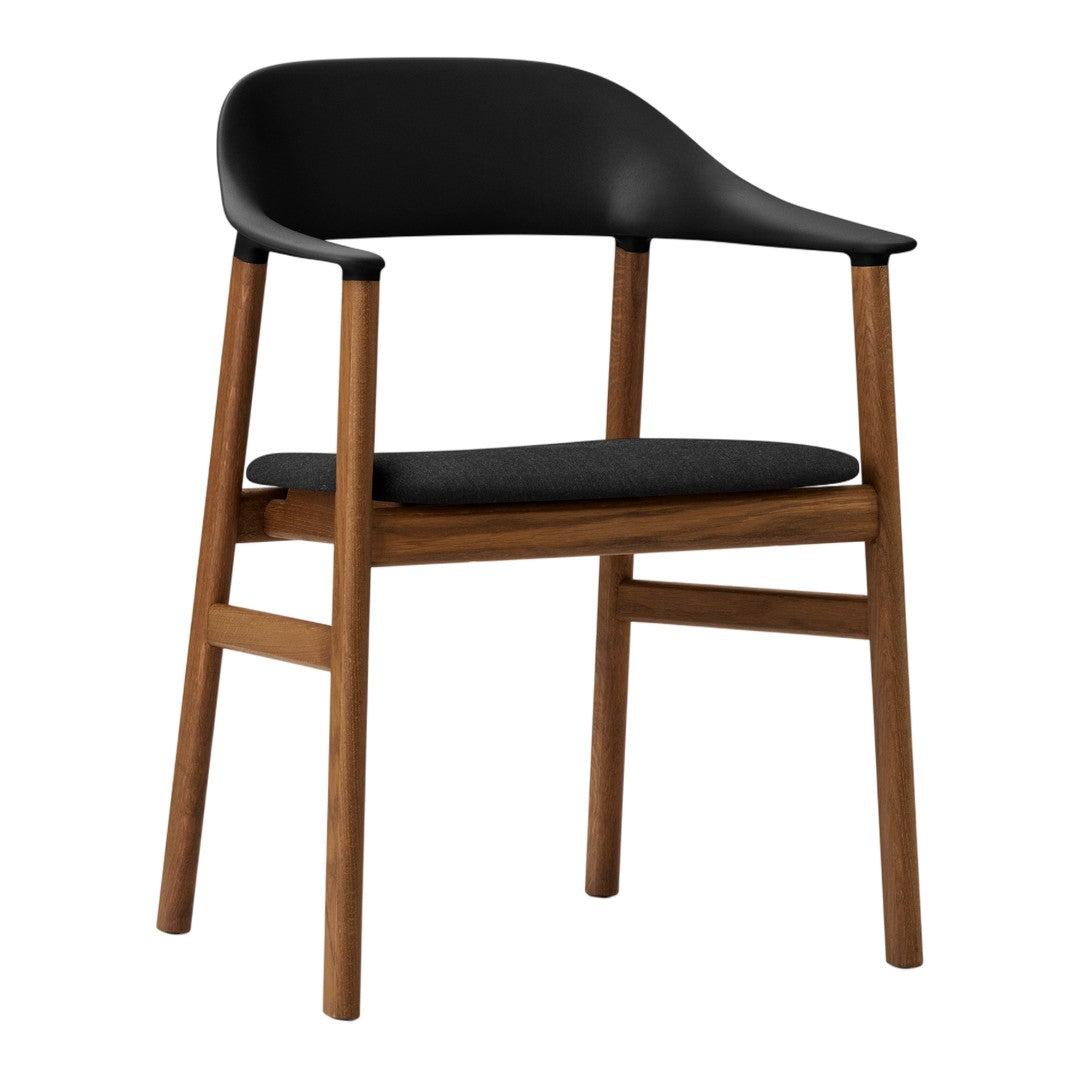 Black curved chair with a wooden frame, featuring a sleek and modern design, perfect for stylish interiors.