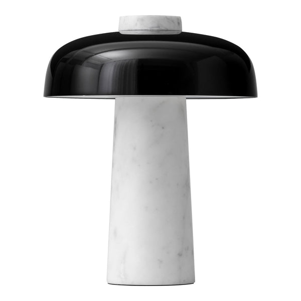 Black and white table lamp with a glossy dome shade and a sleek marble base, featuring smooth curves and clean lines.