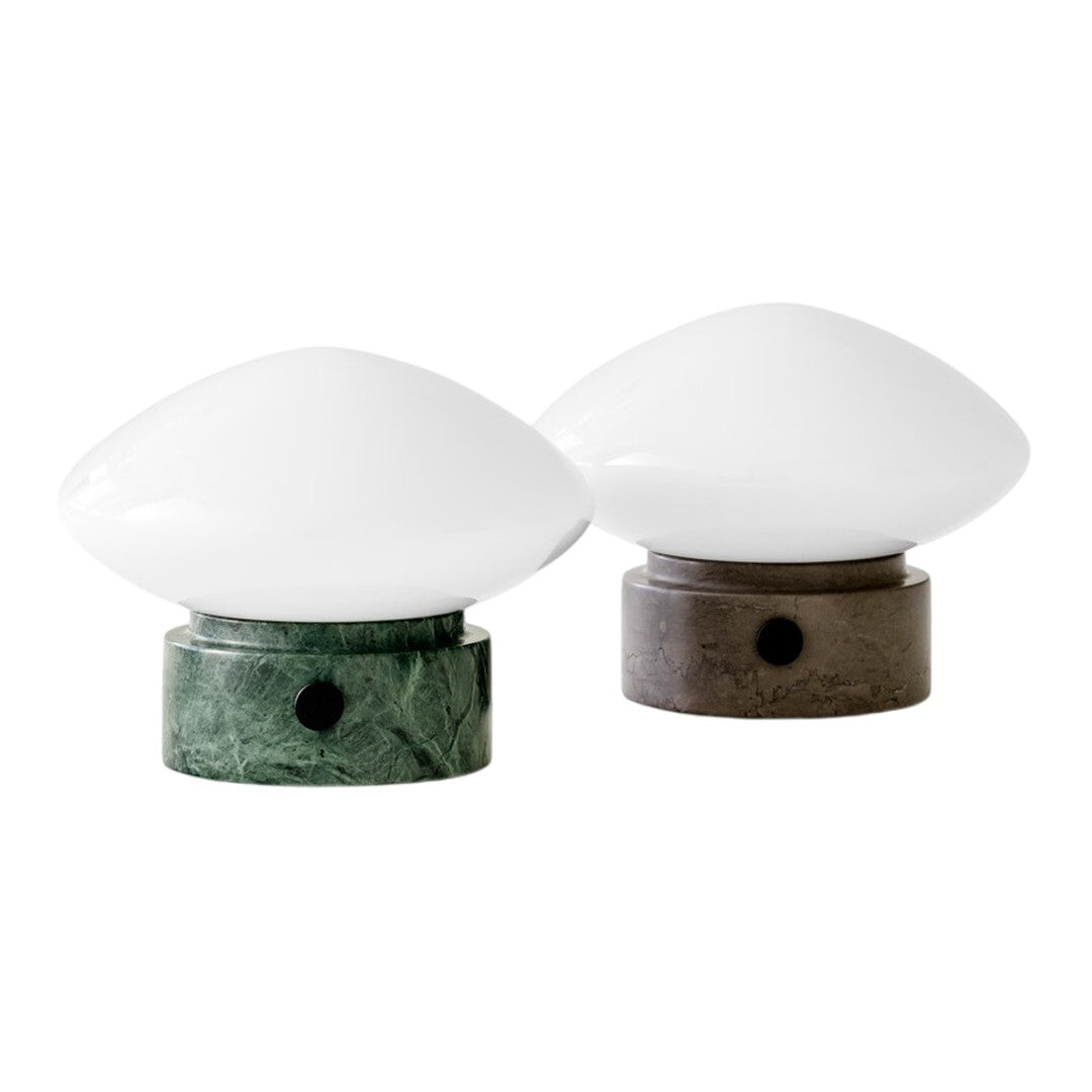 Elegant green and brown marble base lamps with smooth white glass shades, perfect for modern decor.