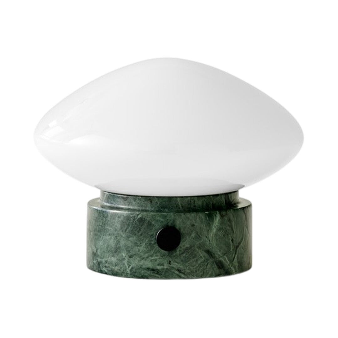 Sleek white glass lamp shade on a textured green marble base, adding elegance to any space.