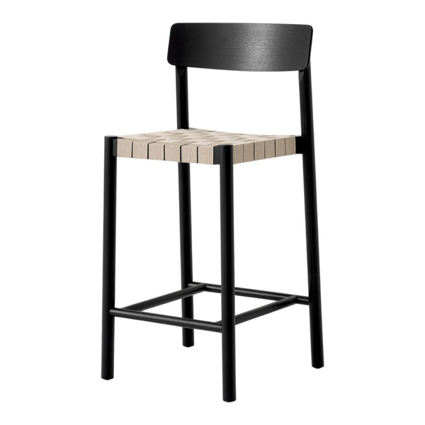 Black wooden bar stool with a horizontal slat-patterned beige seat, offering a modern and minimalist design.