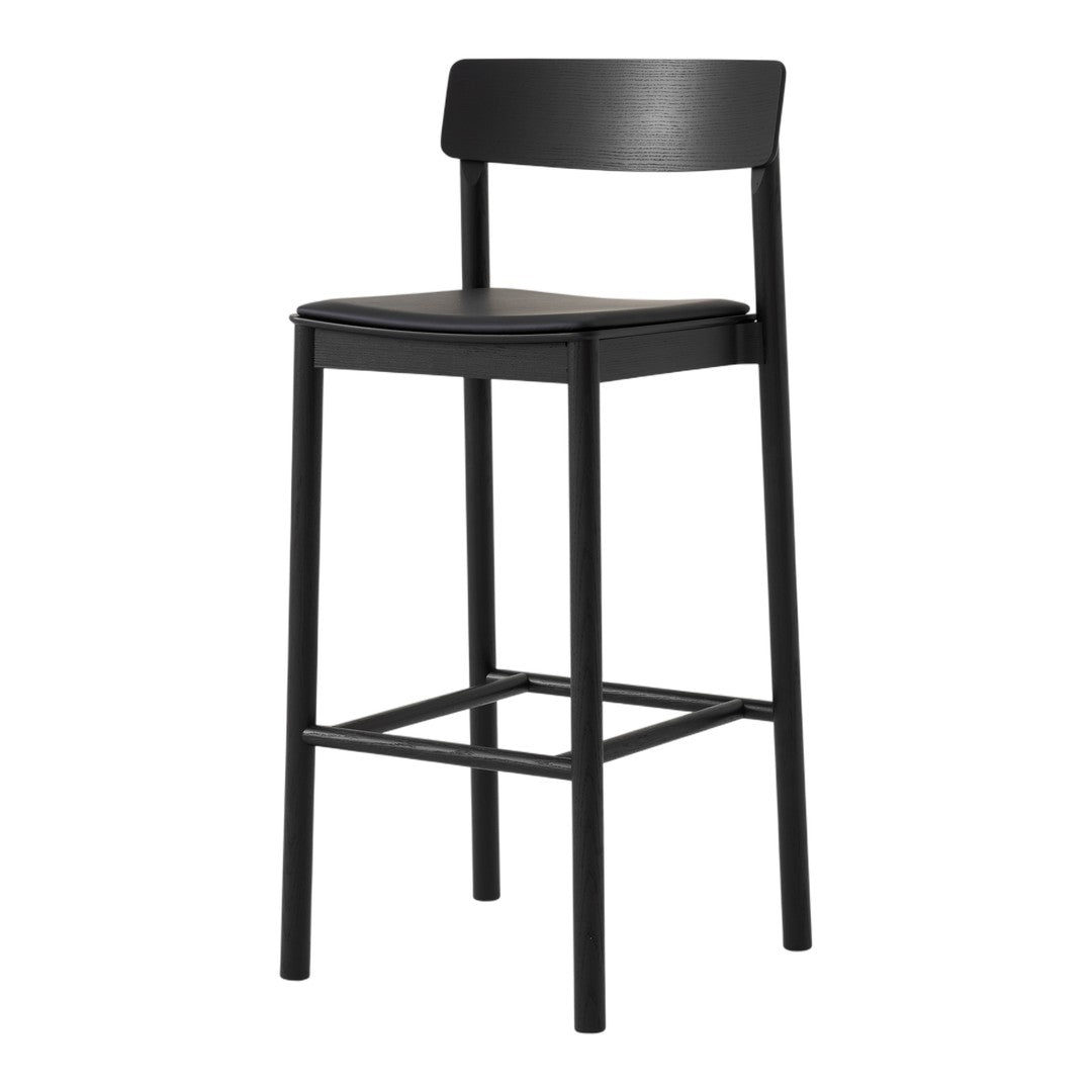 Black bar stool with a sleek, minimalist design and smooth matte finish. Perfect for modern decor.
