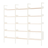 White shelving unit with light wood shelves, featuring a clean, modern design and minimalist aesthetic.