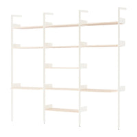 White shelving unit with light wood shelves, featuring a modern, minimalist design and clean lines.