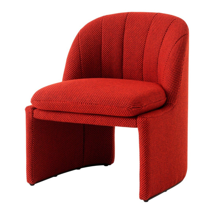 Textured red chair with subtle patterns, featuring a modern, curved design and plush seating for stylish decor.