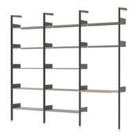 Modern shelving unit featuring sleek black metal frame and light gray shelves with a warm wooden accent.