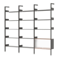 Modern gray shelving unit with sleek metal and wood accents, featuring open and closed storage spaces.