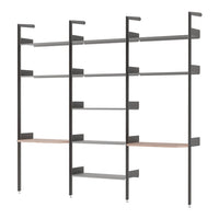 Modern shelving unit in dark gray metal with natural wood accent, featuring sleek, minimalist lines and open design.