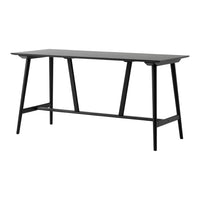 Sleek black table with a smooth surface and minimalist design, featuring clean lines and tapered legs.