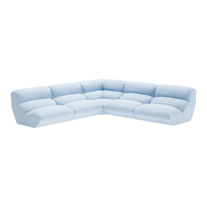 Light blue sectional sofa with a sleek design and plush, quilted cushions for a modern touch.