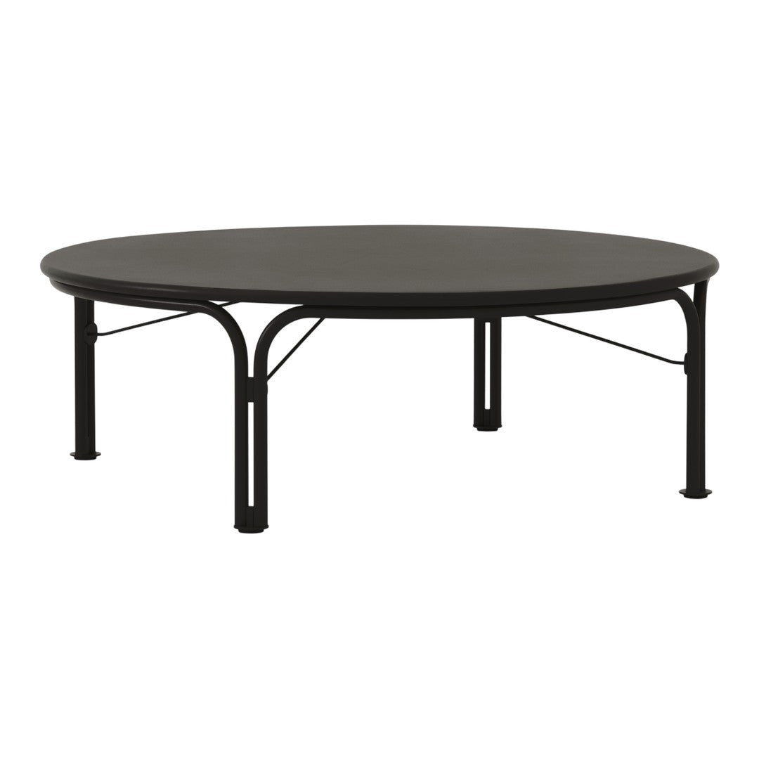 Round black coffee table with a smooth surface and sleek black metal legs, featuring minimalistic design.