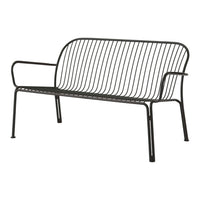 Black metal bench with sleek, vertical wire design and minimalist silhouette for a modern outdoor aesthetic.
