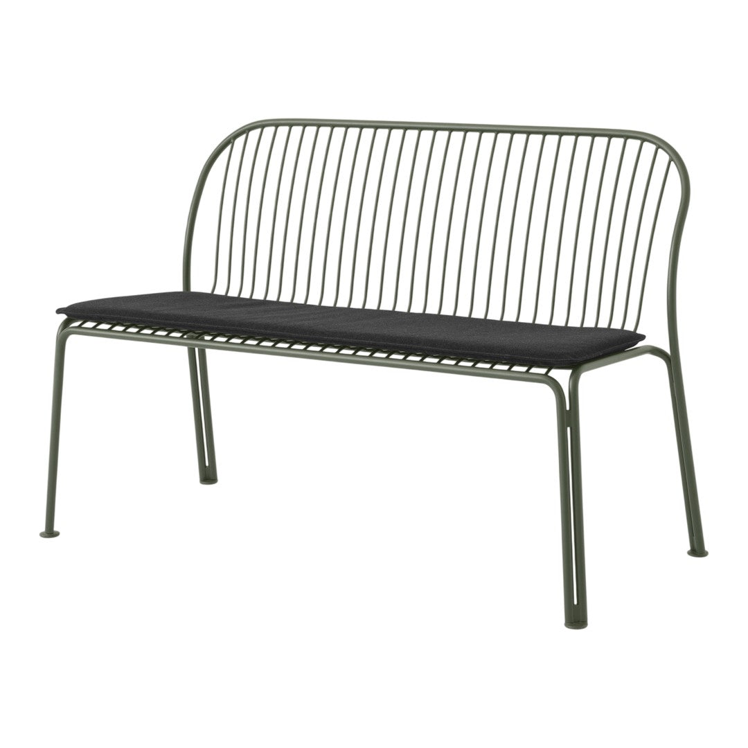 Green metal bench with sleek, vertical lines and a black cushioned seat. Modern design perfect for outdoor settings.