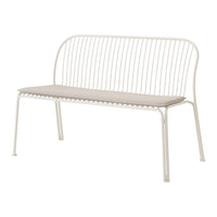 White metal bench with a minimalist design and soft beige cushion, featuring sleek lines and an elegant pattern.