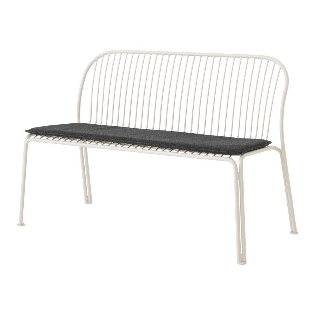 White metal bench with a sleek, minimalist design and a contrasting black cushion for added comfort.