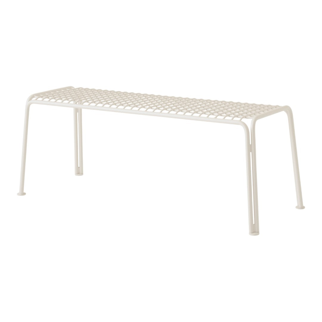 White metal bench with a perforated pattern, minimalistic design ideal for modern spaces.