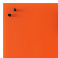 Bright orange surface with two sleek black knobs, creating a modern, bold contrast. Perfect for vibrant decor.