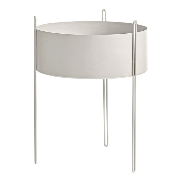 Minimalist round planter in soft white with sleek metal legs, perfect for modern decor.