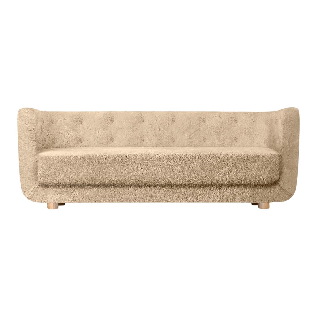Beige tufted sofa with a soft, textured surface and modern design. Ideal for stylish and cozy interiors.