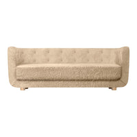 Beige tufted sofa with a soft, textured surface and modern design. Ideal for stylish and cozy interiors.