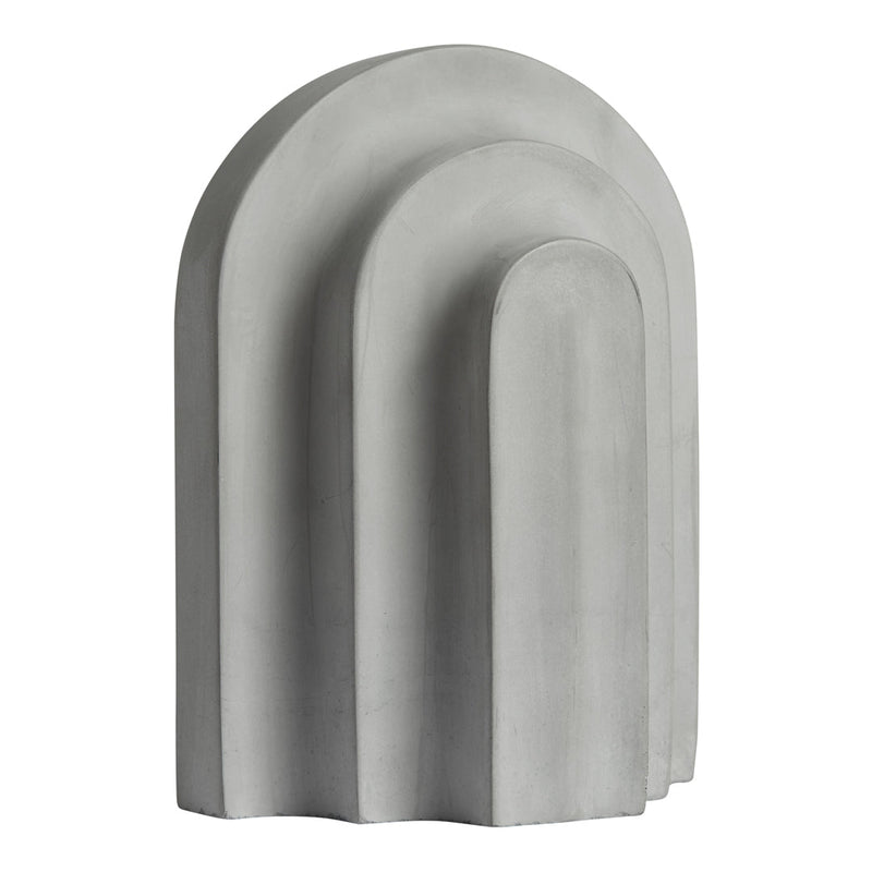 Gray concrete sculpture with smooth, rounded arch patterns in a minimalist design. Ideal for modern decor.
