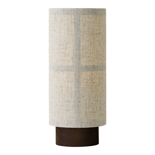 Beige cylindrical lamp with subtle gray cross pattern and a dark wooden base. Perfect for modern decor.