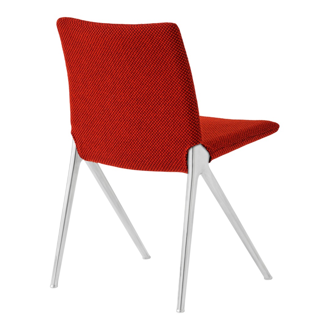 Red textured chair with sleek silver legs, showcasing a modern and vibrant design. Perfect for contemporary spaces.