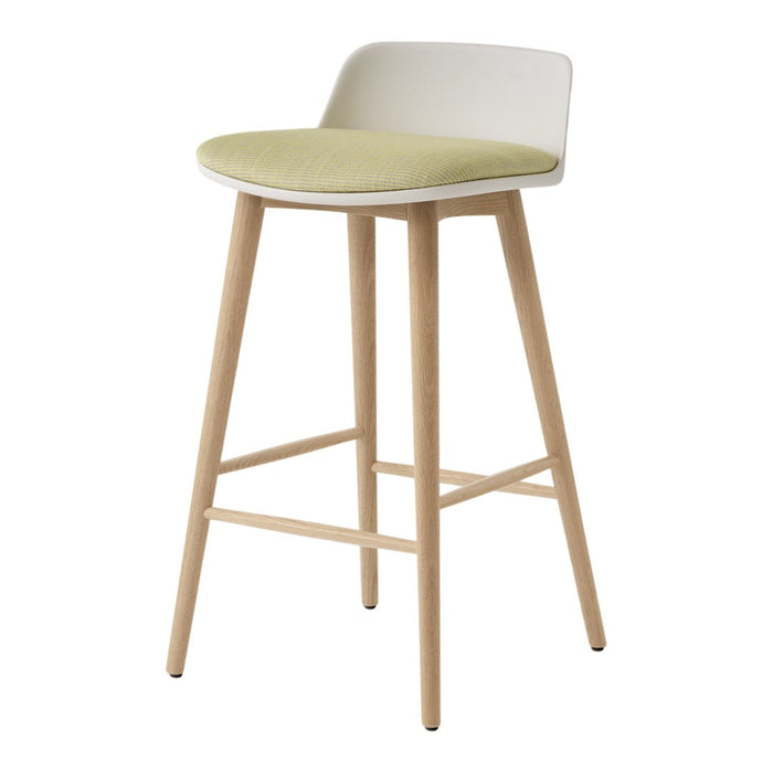Modern bar stool featuring a white backrest, green seat cushion, and natural wood legs. Stylish and minimalistic design.